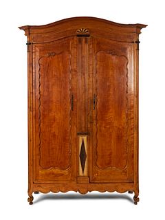 A Continental Parquety Inlaid and Carved Fruitwood Armoire
Height 110 x width 55 1/2 x depth 16 inches.