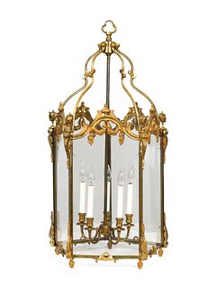 A Pair of Louis XVI Style Gilt Metal Hall Lanterns
Height 38 x diameter 21 inches.