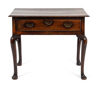 A George III Provincial Oak Side Table
Height 28 x length 33 1/2 x depth 21 1/2 inches.