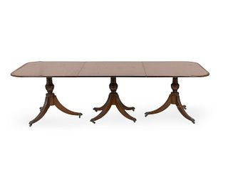 A Regency Style Mahogany Three-Pedestal Dining Table
Height 29 1/2 x length 104  x depth 47 inches.
