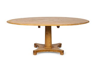 A Regency Style Pine Tilt-Top Extension Table
Height 30 x diameter 54 inches.