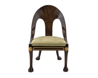 A Regency Style Barrel-Back Chair
Height 37 x width 21 1/2 x depth 21 inches.