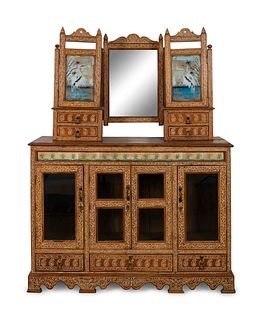 An Anglo-Indian Carved and Inlaid Sideboard with Swing Mirror
Height 77 x width 58 1/2 x depth 20 3/4 inches.