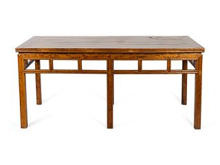 A Chinese Elmwood Table
Height 32 x length 70 x depth 33 1/2 inches.
