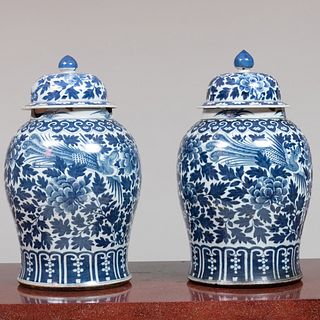 Pair of Chinese Blue and White Jars and Covers  on a Pair of Ebonized Stands