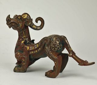 A Gold and Silver-Inlaid Bronze Mythical Beast