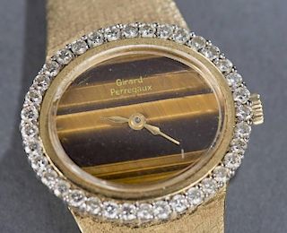 Girard Perregaux tigers eye 18kt gold watch.