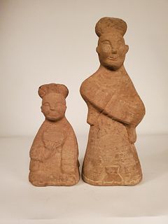 Two Eastern Han Dynasty carved stone smiling figures