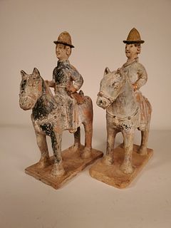 A pair of Chinese Yuan/Ming green-glazed equestrians
