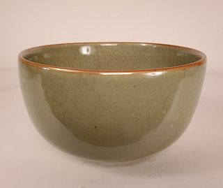 A beautiful crackle glazed celadon bowl with cafe au
