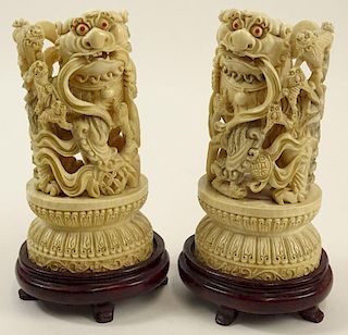 Pair Chinese Carved Ivory Foo Dogs on Hardwood Stands.