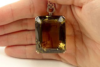 Unusually Large 157 Carat Brown Topaz and 14 Karat Yellow Gold Lady's Pendant.