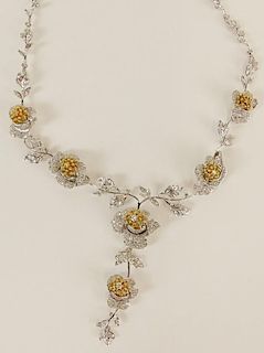 Lady's fine quality 18 karat white and yellow gold flower necklace.