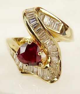 Lady's vintage pear shape ruby, baguette cut diamond and 18 karat yellow gold ring.