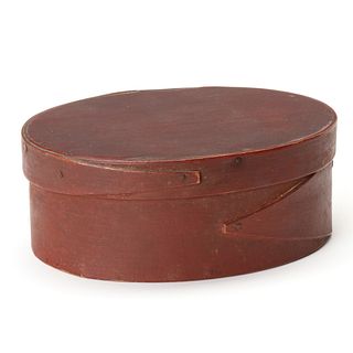 A GOOD 19TH CENTURY OVAL PANTRY BOX IN OLD RED PAINT