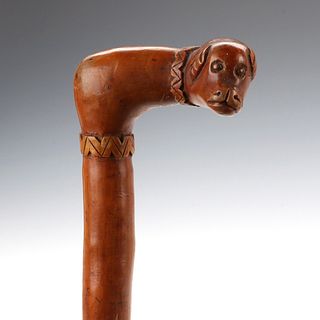 A 19TH CENTURY CROOK HANDLE CANE WITH DOG'S HEAD