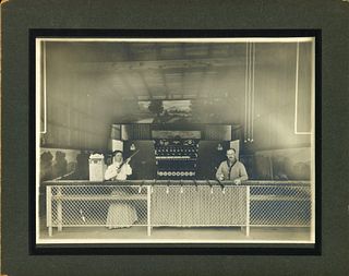 A PERIOD MOUNTED PHOTOGRAPH OF 1900s SHOOTING GALLERY
