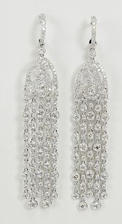 Pair of lady's approx. 5.0 carat round cut diamond and 18 karat white gold chandelier earrings.