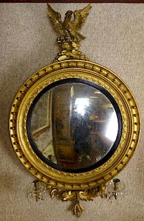 Early 19th Century American Federal Carved and Gilt Wood Convex Mirror With Figural Eagle Finial.