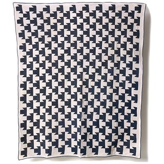 AN EARLY 20 C. BLUE AND WHITE T-QUARTETTE PATTERN QUILT