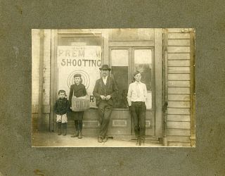 TWO MOUNTED PHOTOGRAPHS OF SHOOTING GALLERIES, C. 1910