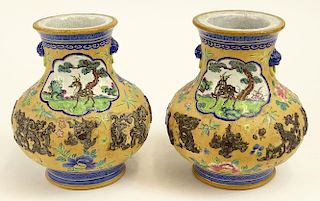 Pair of 20th century Chinese enamel decorated pottery vases.