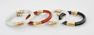 Group of Four 14K Yellow Gold, Jadeite and Hardstone Bangles