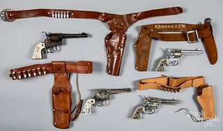 Four cap guns with holsters