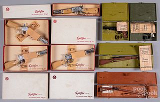 Eight boxes of miniature toy cap guns