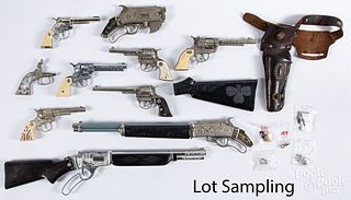 Large group of cap gun parts and pieces