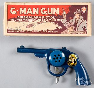 Boxed Marx tin lithograph wind-up pistol
