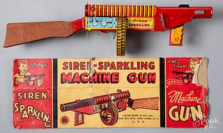 Boxed Marx tin lithograph wind-up machine gun