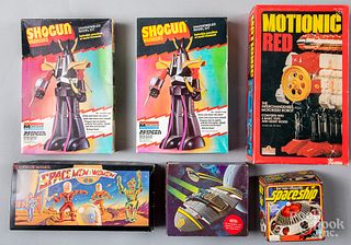 Group of boxed space toys