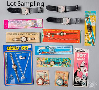 Large group of toy watches on original cards