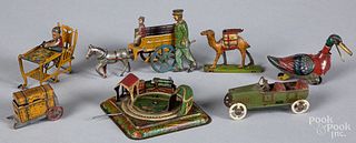 Seven tin lithograph penny toys