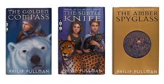 PULLMAN, Philip. [His Dark Materials trilogy:] The Golden Compass.  - The Subtle Knife.  - The Amber Spyglass. New York: Alfred A. Knopf, 1996-1997-20