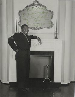 ARMSTRONG, Louis (1901-1971). Photograph signed and inscribed in image ("Louis 'Satchmo' Armstrong), to Jackie Mabley, N.p., [ca late 1940s].
