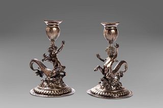 Pair of silver candle holders with young tritons, Genoa, early 19th century