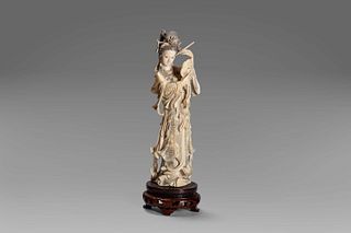 Ivory sculpture depicting a female figure with a mirror, China, early 20th century