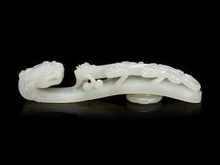 A Large and Finely Carved White Jade 'Chilong' Belt Hook
Length 5 1/4 in., 13.3 cm