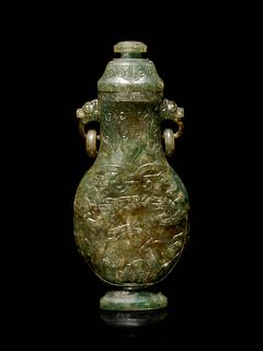 A Carved Spinach Green Jade Ring-Handled Vase and Cover
Height 7 1/4 in., 18.5 cm.