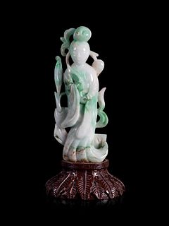 An Apple Green and White Jadeite Figure of a Lady Immortal
Height 6 1/4 in., 15.8 cm.