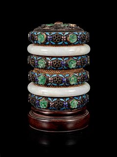A Jadeite and Hardstone Inset Enameled Jewelry Box and Cover
Height 4 1/4 in., 10.8 cm.