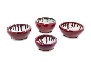 Four Monochrome Red Glazed Tripod Incense Burners
Diameter of largest 10 3/4 in., 27.3 cm. 