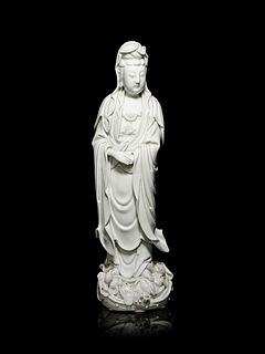 A Large Blanc-de-Chine Porcelain Figure of Guanyin
Height 18 1/2 in., 47 cm.