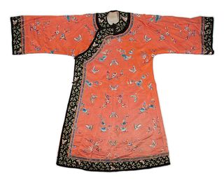 Three Apricot Ground Embroidered Silk Lady's Articles
Length of longest from back of collar to hem 54 7/8 in., 140 cm.