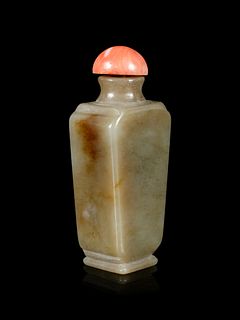 A Russet and Celadon Jade Snuff BottleHeight overall 3 in., 7.62