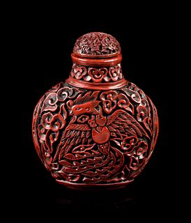 A Carved Red Lacquer Snuff Bottle
Height overall 3 in., 7.6 cm.