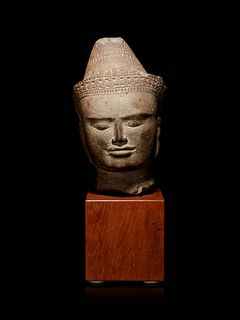 A Khmer Greystone Head of Buddha
Height of head 9 1/2 in., 24.13 cm.