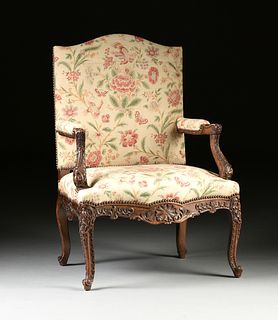 A RÉGENCE STYLE UPHOLSTERED AND CARVED OAK HIGH BACK FAUTEUIL, LATE 19TH CENTURY,